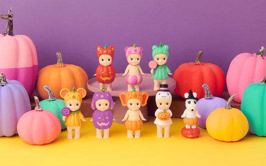 Sonny Angel pumpkin Halloween figures with colorful pumpkins in playful pop mart, smiski, labubu style