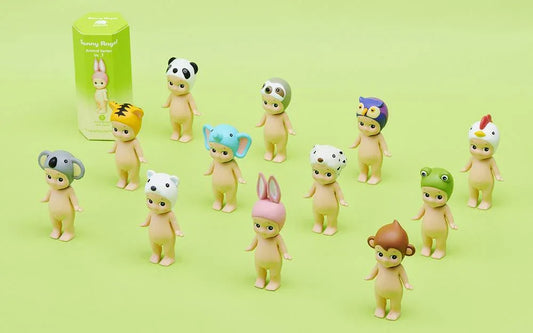 Sonny Angel Animal Series figures with various animal hats on a green background, pop mart style collectibles