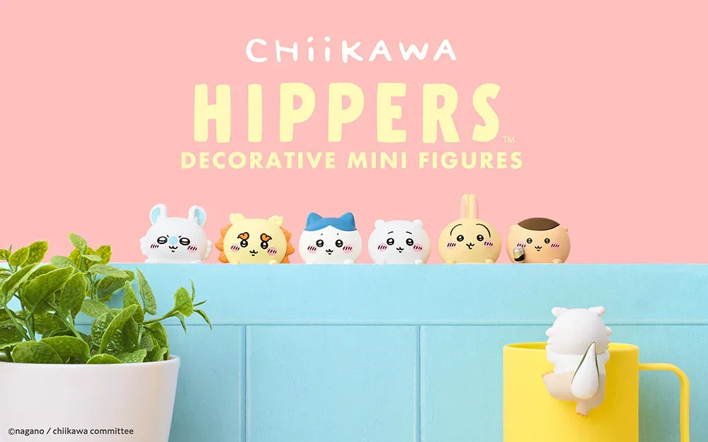 Chiikawa Hippers decorative mini figures lined on blue surface with green plant and yellow cup, cute collectible toys